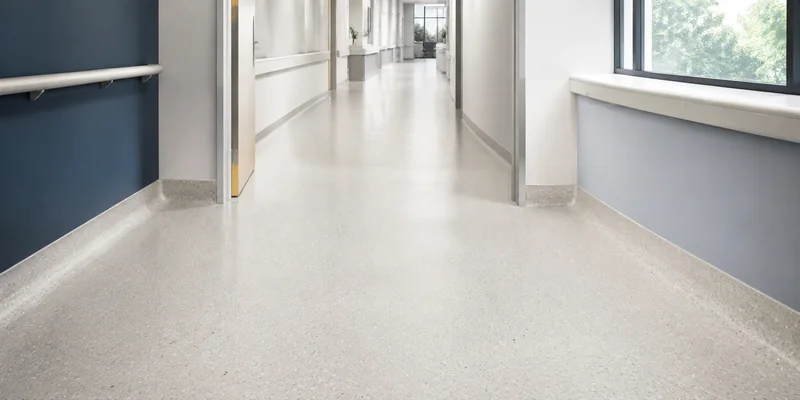 Continuous seamless epoxy resin flooring with a coved floor-to-wall transition